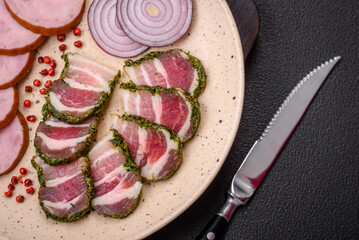 Delicious fresh bacon stripes with spices and salt