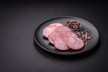 Delicious smoked sausage with salt and spices cut into slices
