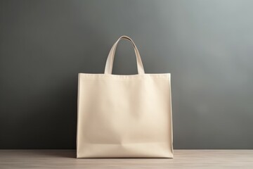 eco-friendly white cotton bag with ties on peach background