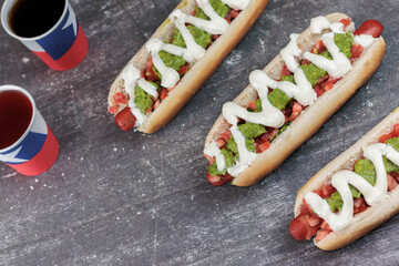 Completo Italiano Chileno: hot dog bun with vianesa, tomato, palta and mayo with poly paper cups...