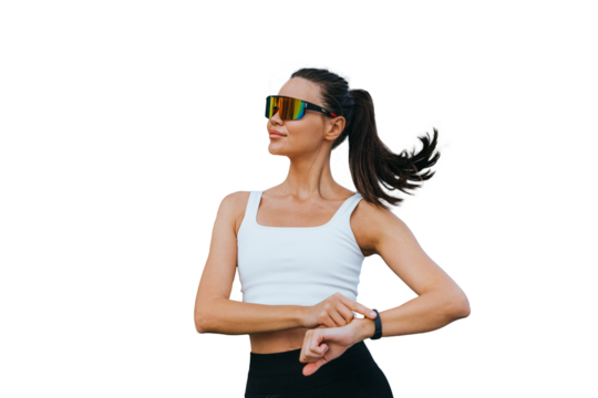 Tanned multiethnic young woman in sportswear, sunglasses measuring heart beat using fitness bracelet makes break of jogging standing against transparent background  . Sport, fitness.