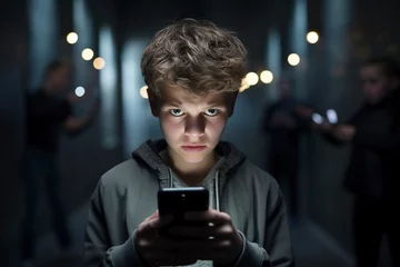 Fotobehang teenager being cyberbullied on a smart phone © Jorge Ferreiro