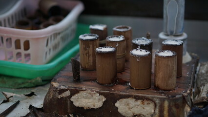 The process of making putu cake which is put into a mold made of bamboo and then steamed with steam, a traditional Indonesian snack.