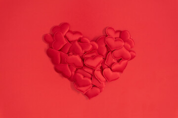 Valentine's Day concept. valentines, red hearts confetti on red background. Flat lay, top view, copy space