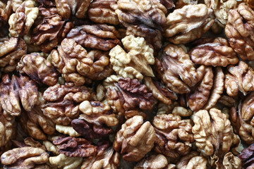 a pile of shelled colorful walnuts