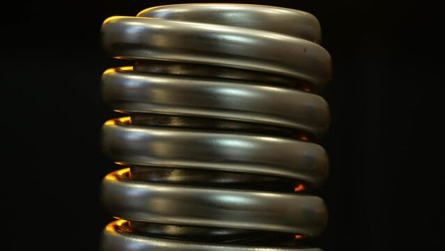 Close-up of a rotating metal double helix