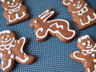 Festive biscuits brown color and decorated and shaped hare man and bear