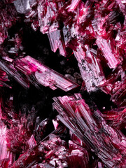 Erythrite crystals (also knwon as red cobalt) macro detail texture background. close-up raw rough...
