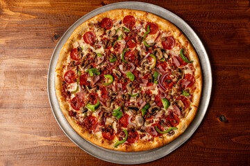 Meat lovers pizza with green peppers