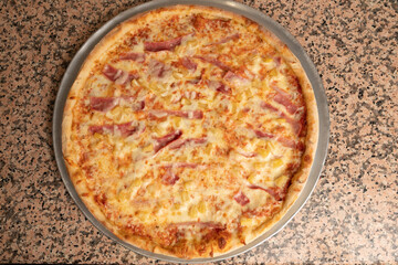 Hawaiian pizza with ham and pineapple