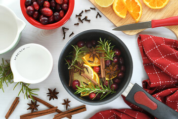 Making Christmas Scent to give as a gift - oranges, lemons, cranberries, cinnamon, star anise,...
