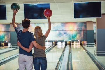 Couple playing bowling