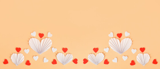 Many paper and felt hearts on beige background, top view. Valentine's Day celebration