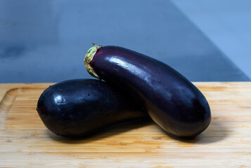 eggplants on a wooden board