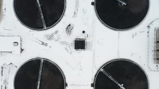 Water treatment facility in winter, top down aerial view 