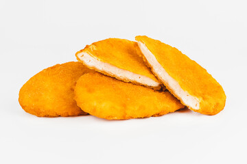 Breaded Chicken Inner Fillet, Chicken Breaded Raw Meat. Fast cooking.Breaded Chicken nuggets Fillet with salad on a White Background,food at home. Fast homemade food.Chicken breaded schnitzels.