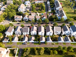 Aerial view of a neighborhood of low-rise buildings on a summer day. Single-family homes from a bird's eye view.