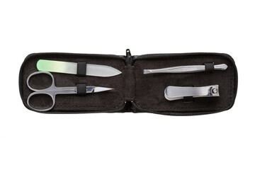 Set of steel manicure instruments and tools in black leather case isolated on white background