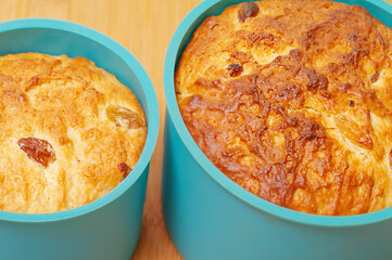 Sweet buttery pastry with raisins in a silicone dish. Happy Easter.
