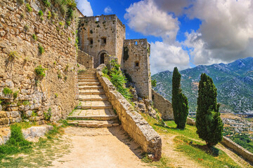 Fototapeta na wymiar Summer landscape - view of the stairs in the Klis Fortress, near Split on the Adriatic coast of Croatia