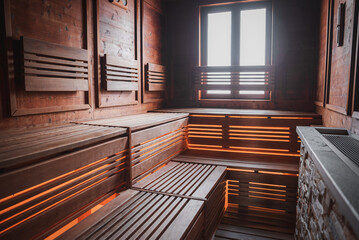 Interior of a wooden sauna in Venice, Italy. Relaxing and cozy atmosphere. No steam or people visible. Perfect for wellness, relaxation, and travel concepts.
