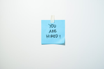 Motivational words for personal development, you are hired, inspirational handwriting on sticky notes