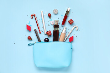 Composition with bag, cosmetic products and Christmas decorations on color background