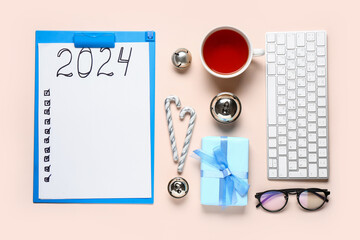 Paper sheet with empty to do list, cup of tea and keyboard on pink background