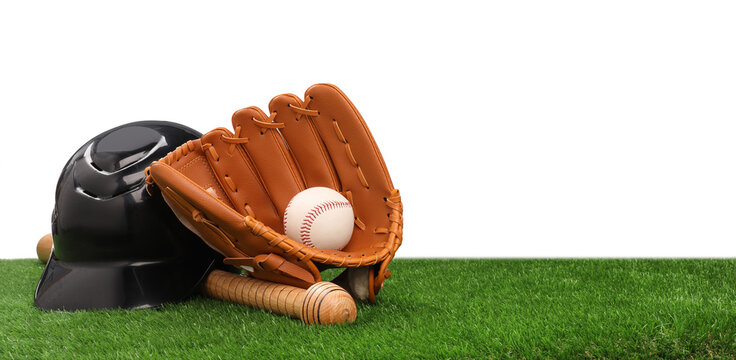 Baseball bat, ball, batting helmet and glove on artificial grass against white background, space for text