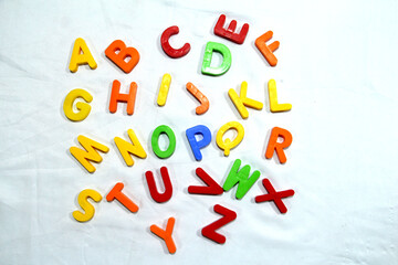 Colourful alphabet character written in multicolored plastic for kids. kids learn letters.