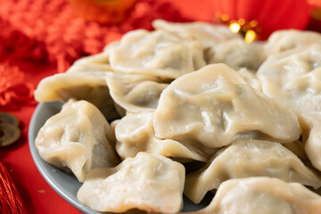 Fototapeta na wymiar Close up fresh boiled dumplings . traditional food on Chinese New Year background. 