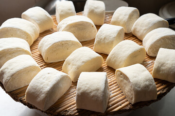 Fototapeta na wymiar closeup of raw steamed bun or steamed bread on chopping board