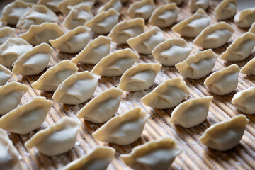 making dumplings in the kitchen. traditional food raw dimplings	
