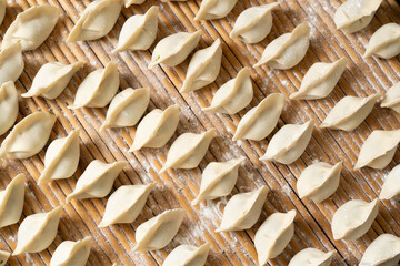 making dumplings in the kitchen. traditional food raw dimplings	
