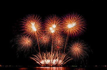Fireworks show under defocus or blur concepts with isolated black background at night, this...