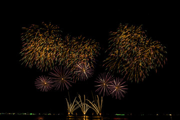 Fireworks show under defocus or blur concepts with isolated black background at night, this...
