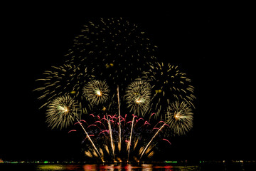Fireworks show under defocus or blur concepts with isolated black background at night, this...