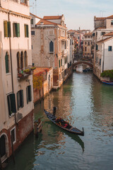 Fototapeta na wymiar A serene gondola glides through the iconic canals of Venice, Italy. The timeless beauty of the city is captured in this classic image.