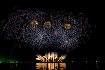 Fireworks show under defocus or blur concepts with isolated black background at night, this...