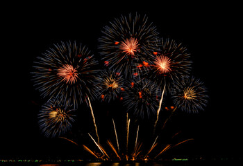 Fireworks show under defocus or blur concepts with isolated black background at night, this celebration is for the International Fireworks Festival in Pattaya on Nov 24-25 in Thailand.