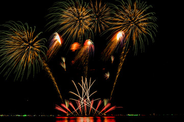 Fireworks show under defocus or blur concepts with isolated black background at night, this...