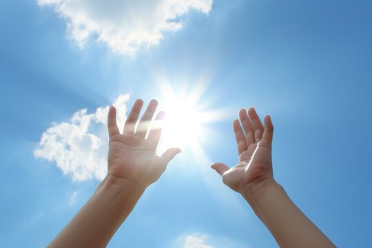Hands to heaven, person with hand up looking at the sky