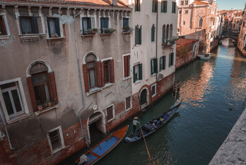 Explore the charm of Venice with this serene canal view. The image captures the essence of the city...
