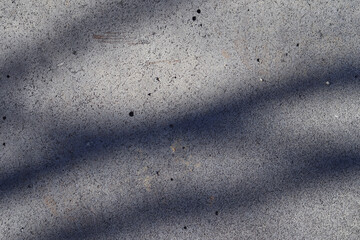 Shadow of tree on cement floor. Abstract background and texture for design.