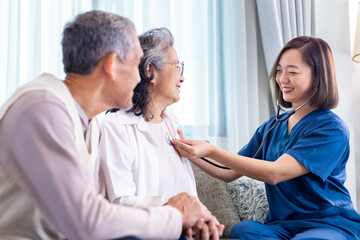 Senior couple get medical service visit from caregiver nurse at home while having medical checkup on heart and cardiovascular system for health care and pension welfare insurance concept