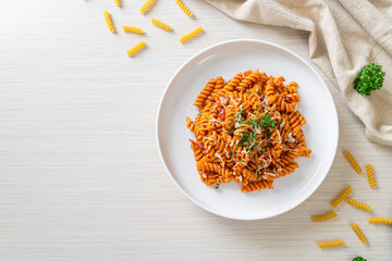 spirali or spiral pasta with tomato sauce