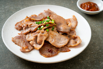 grilled pork neck sliced on plate