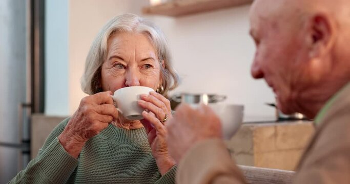 Tea, elderly couple and funny with people in a retirement home together for love or bonding in the morning. Smile, drink and happy seniors laughing ay a joke in the living room of an apartment