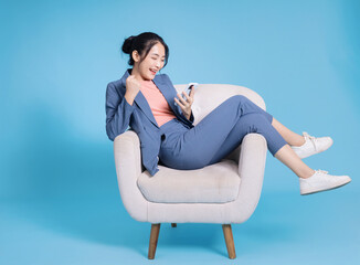 Photo of young Asian businesswoman on background