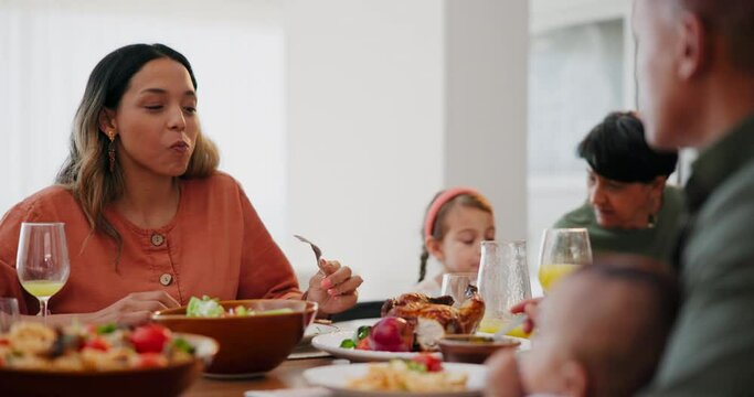 Family talking, thanksgiving dinner and home with eating, smile or relax with food in dining room. Woman, man and child at reunion, party or event with lunch, brunch or conversation at table in house